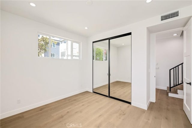 2100 Carnegie Ln, Redondo Beach, CA 90278 - unfurnished bedroom with light wood-type flooring, recessed lighting, and a closet