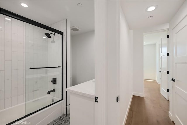 2100 Carnegie Ln, Redondo Beach, CA 90278 - bathroom featuring combined bath / shower with glass door, vanity, recessed lighting, and wood finished floors