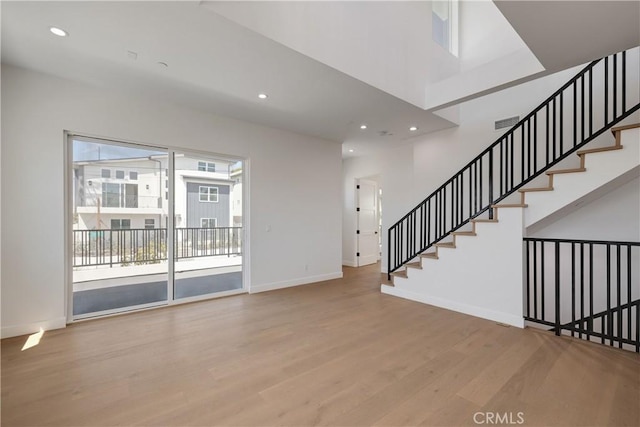 2100 Carnegie Ln, Redondo Beach, CA 90278 - unfurnished living room featuring wood finished floors, recessed lighting, and stairway