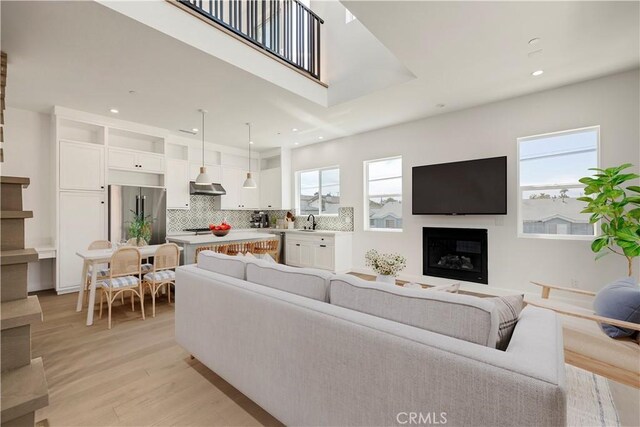 2100 Carnegie Ln, Redondo Beach, CA 90278 - living room featuring recessed lighting, light wood finished floors, and a fireplace