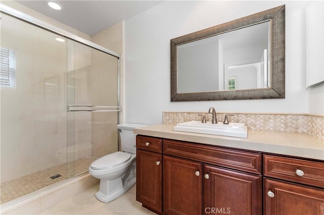 full bathroom with tile patterned floors, toilet, a stall shower, and vanity