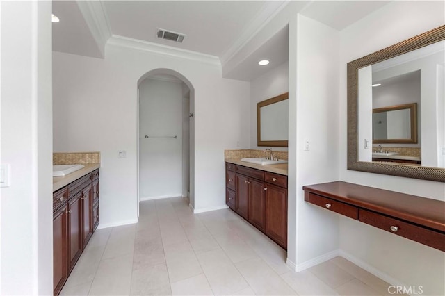 bathroom with visible vents, baseboards, a sink, ornamental molding, and two vanities