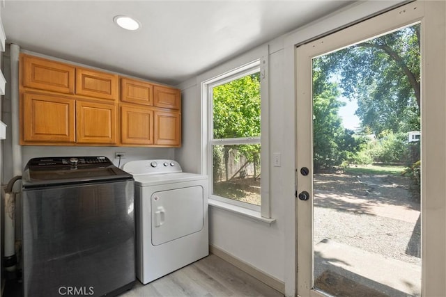 965 E 8th St, Chico, CA 95928 - laundry area featuring washer and dryer, cabinet space, light wood-type flooring, and baseboards