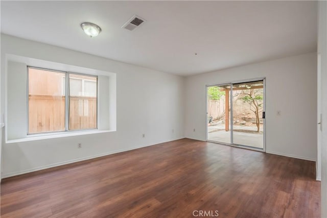 11962 Verona Dr, Fontana, CA 92337 - unfurnished room featuring visible vents, baseboards, and wood finished floors