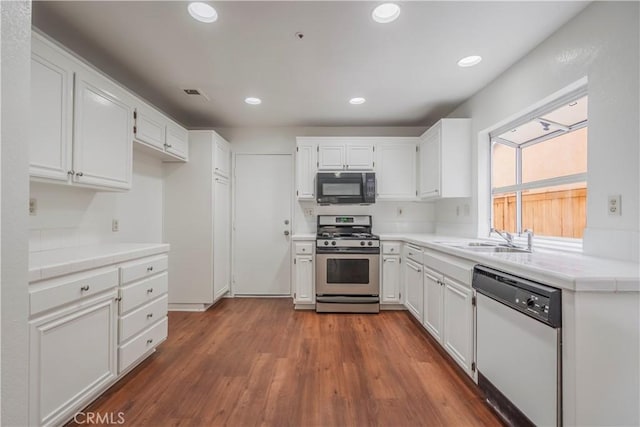 11962 Verona Dr, Fontana, CA 92337 - kitchen with black microwave, visible vents, dishwasher, stainless steel range with gas stovetop, and a sink