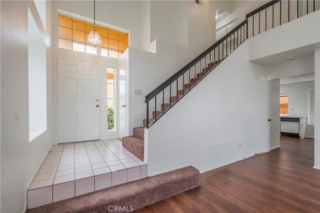 11962 Verona Dr, Fontana, CA 92337 - foyer with a high ceiling, wood finished floors, baseboards, and stairs