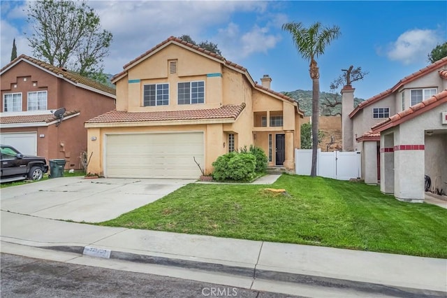 11962 Verona Dr, Fontana, CA 92337 - traditional-style house featuring a tiled roof, an attached garage, a chimney, fence, and driveway