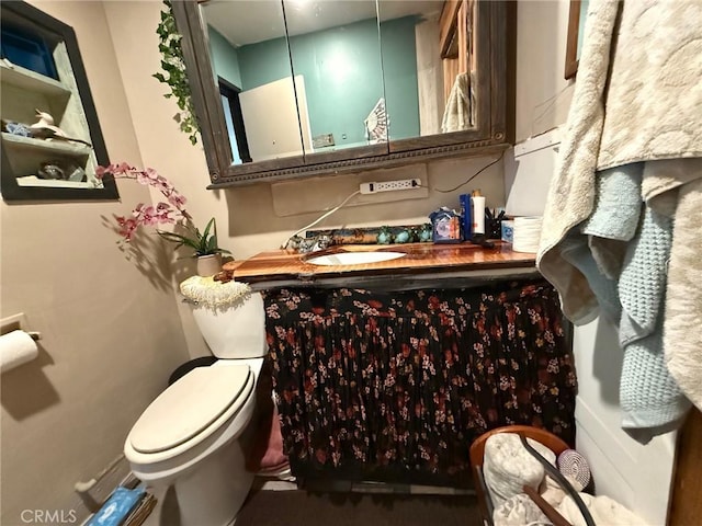 half bath with vanity and toilet