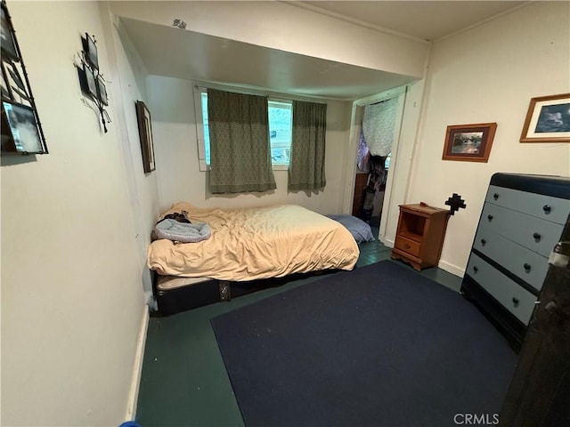 bedroom featuring baseboards