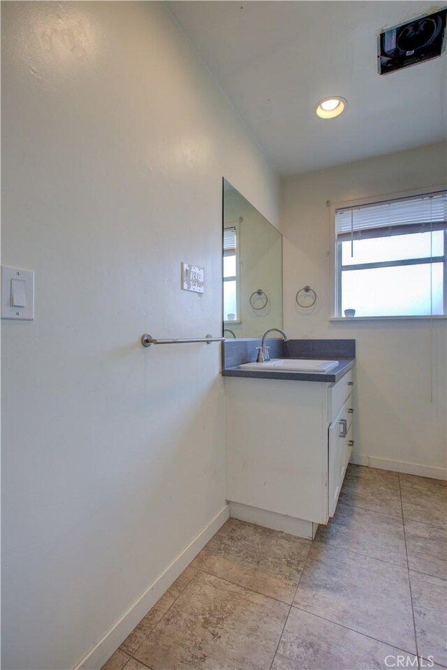1124 S Moffett Rd, Turlock, CA 95380 - bathroom with tile patterned floors, vanity, and baseboards