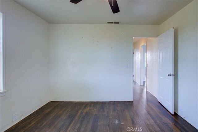 1124 S Moffett Rd, Turlock, CA 95380 - unfurnished room featuring visible vents, a ceiling fan, and dark wood-style floors
