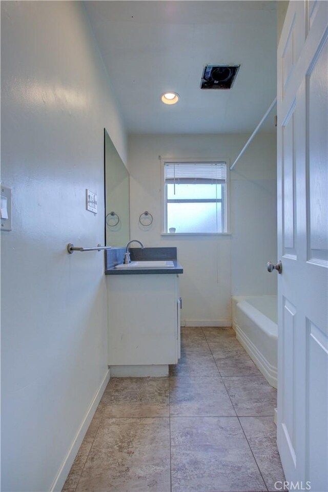 1124 S Moffett Rd, Turlock, CA 95380 - bathroom with recessed lighting, vanity, baseboards, and shower / bathing tub combination