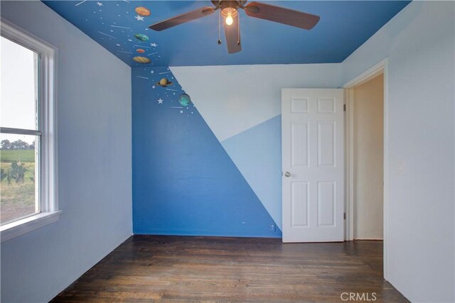 1124 S Moffett Rd, Turlock, CA 95380 - empty room with a ceiling fan and wood finished floors