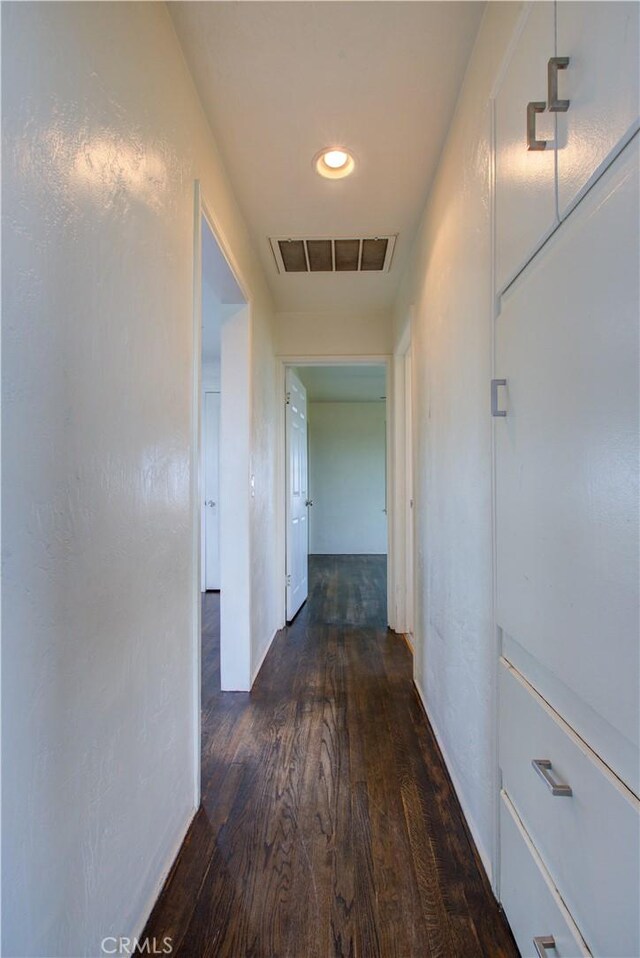 1124 S Moffett Rd, Turlock, CA 95380 - hallway featuring dark wood-type flooring, visible vents, and recessed lighting
