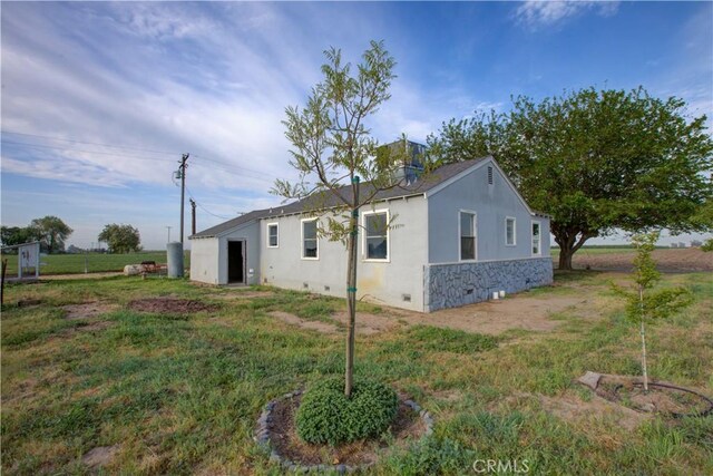 1124 S Moffett Rd, Turlock, CA 95380 - view of home's exterior with crawl space and stucco siding