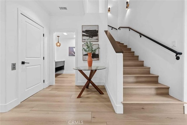 9027 Wonderland Ave, Los Angeles, CA 90046 - stairway with wood finished floors and baseboards