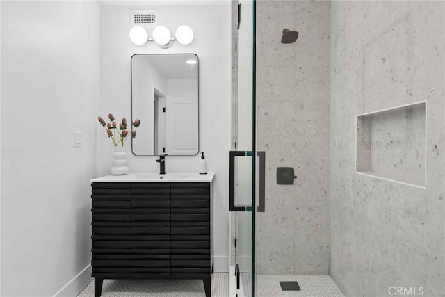 9027 Wonderland Ave, Los Angeles, CA 90046 - full bathroom with vanity, a shower stall, baseboards, and tile patterned flooring