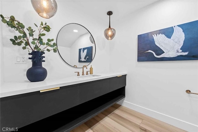 9027 Wonderland Ave, Los Angeles, CA 90046 - bathroom featuring vanity, wood finished floors, and baseboards