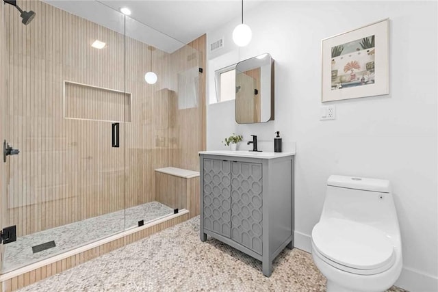 9027 Wonderland Ave, Los Angeles, CA 90046 - full bathroom with baseboards, vanity, a stall shower, and toilet