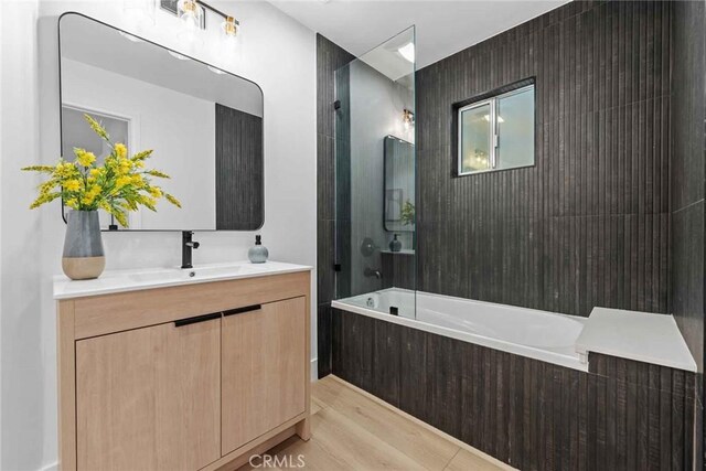 9027 Wonderland Ave, Los Angeles, CA 90046 - full bath featuring vanity, wood finished floors, and  shower combination