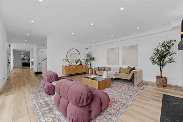 9027 Wonderland Ave, Los Angeles, CA 90046 - living room with light wood-style floors, recessed lighting, crown molding, and baseboards