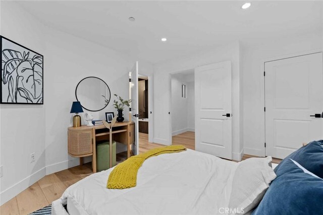 9027 Wonderland Ave, Los Angeles, CA 90046 - bedroom with baseboards, light wood-style floors, and recessed lighting