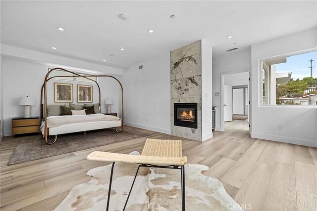9027 Wonderland Ave, Los Angeles, CA 90046 - bedroom featuring light wood finished floors, recessed lighting, a high end fireplace, and baseboards