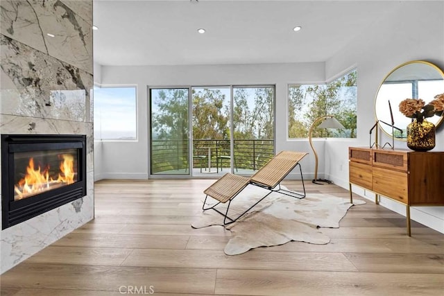 9027 Wonderland Ave, Los Angeles, CA 90046 - living area with a tiled fireplace, wood finished floors, baseboards, and recessed lighting