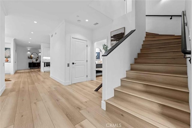9027 Wonderland Ave, Los Angeles, CA 90046 - foyer entrance featuring stairs, light wood finished floors, baseboards, and recessed lighting