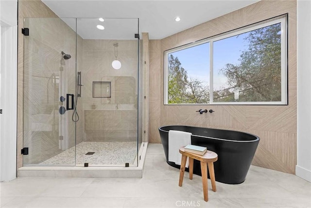 9027 Wonderland Ave, Los Angeles, CA 90046 - bathroom with a freestanding bath, a stall shower, recessed lighting, and tile patterned flooring