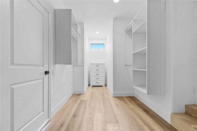 9027 Wonderland Ave, Los Angeles, CA 90046 - spacious closet with light wood-style flooring