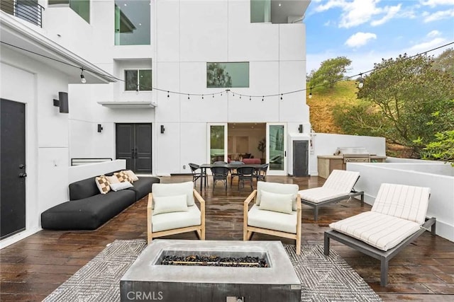 9027 Wonderland Ave, Los Angeles, CA 90046 - view of patio / terrace with an outdoor living space with a fire pit and a deck