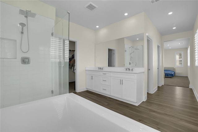 16533 Ground Breaker Ave, Chino, CA 91708 - ensuite bathroom with a shower stall, wood finished floors, baseboards, and visible vents