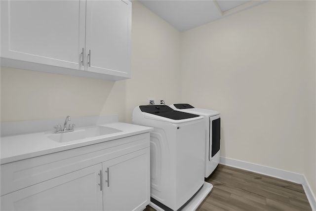 16533 Ground Breaker Ave, Chino, CA 91708 - laundry room featuring baseboards, cabinet space, washer and dryer, a sink, and wood finished floors