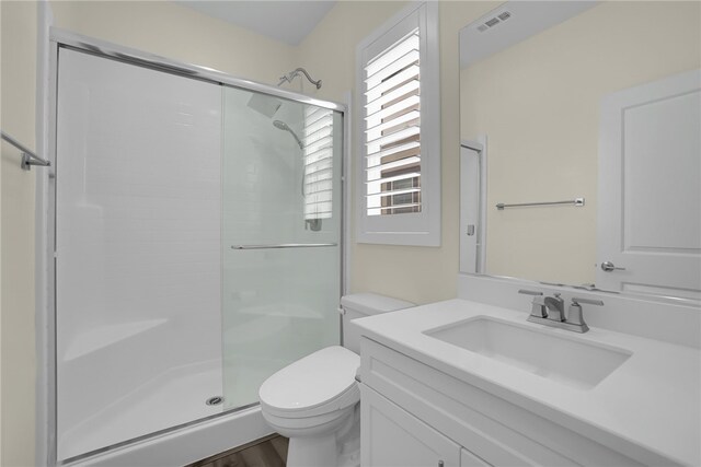 16533 Ground Breaker Ave, Chino, CA 91708 - bathroom with a shower stall, vanity, visible vents, and toilet