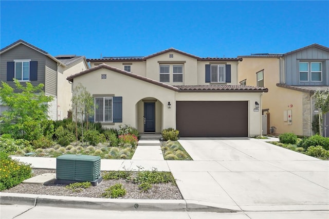 16533 Ground Breaker Ave, Chino, CA 91708 - mediterranean / spanish home featuring concrete driveway, stucco siding, an attached garage, central AC, and a tiled roof