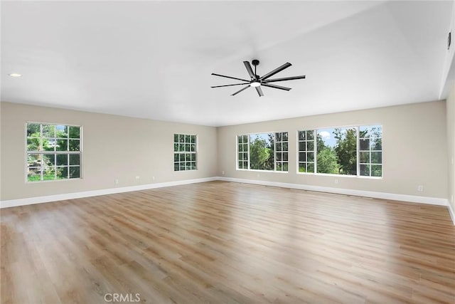 unfurnished room with recessed lighting, light wood-style floors, baseboards, and ceiling fan