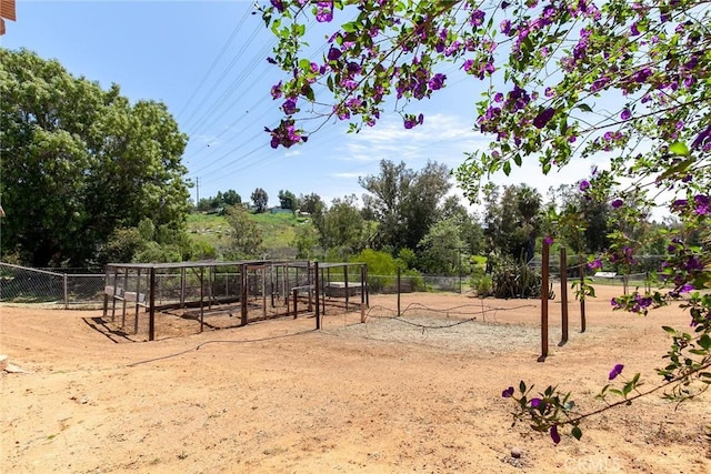 view of property's community with fence