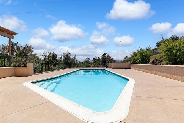 view of pool featuring a fenced in pool, a patio area, and fence