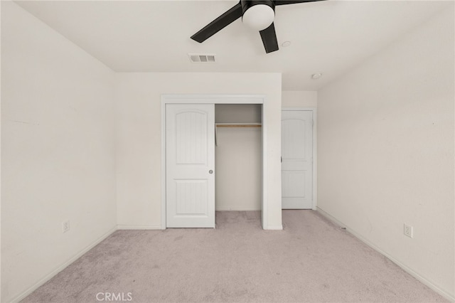unfurnished bedroom with visible vents, a ceiling fan, carpet floors, a closet, and baseboards