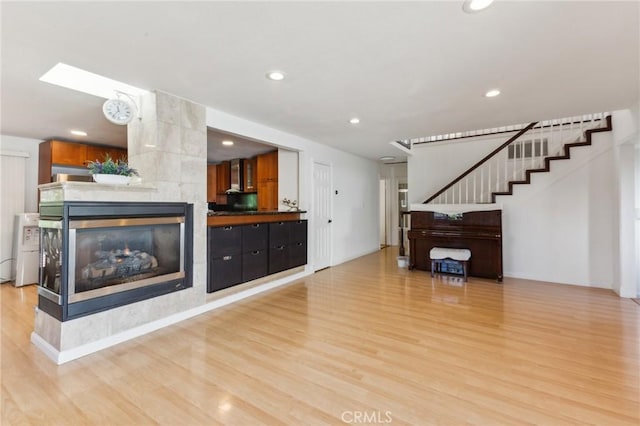 2652 La Salle Way, San Jose, CA 95130 - living room with light wood finished floors, recessed lighting, stairway, and a fireplace