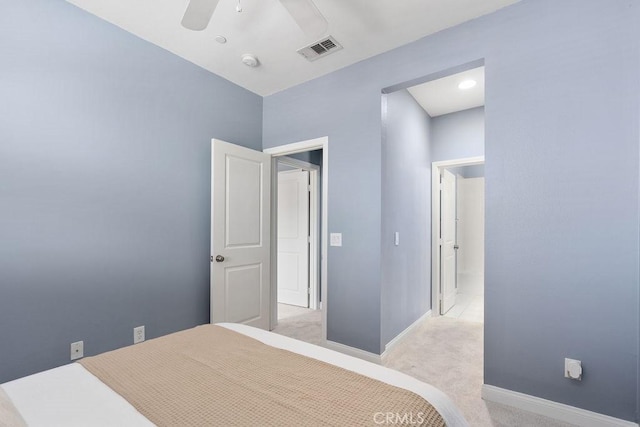 bedroom with light carpet, baseboards, and a ceiling fan