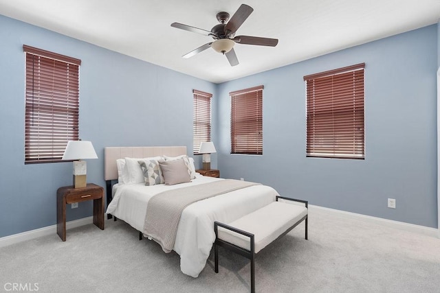 bedroom with carpet flooring, a ceiling fan, and baseboards