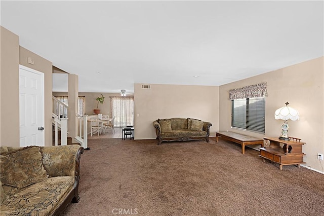 25382 Silverwood Ln, Menifee, CA 92584 - living area with carpet, stairway, and baseboards