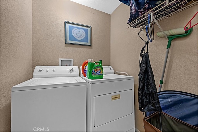 25382 Silverwood Ln, Menifee, CA 92584 - washroom with washing machine and dryer and a textured wall