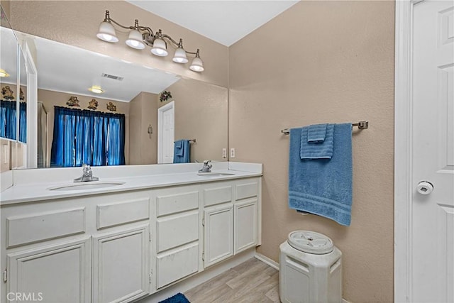 25382 Silverwood Ln, Menifee, CA 92584 - bathroom with double vanity and wood finished floors