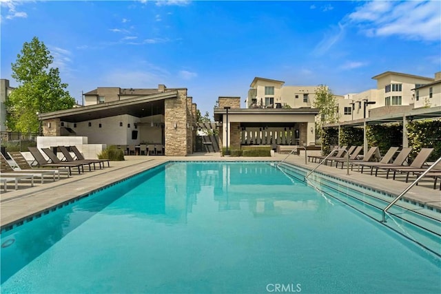 19533 Cardigan Dr, Northridge, CA 91324 - community pool featuring a residential view, fence, and a patio