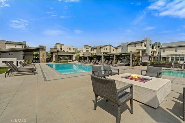 19533 Cardigan Dr, Northridge, CA 91324 - pool featuring a patio, a residential view, fence, and an outdoor fire pit