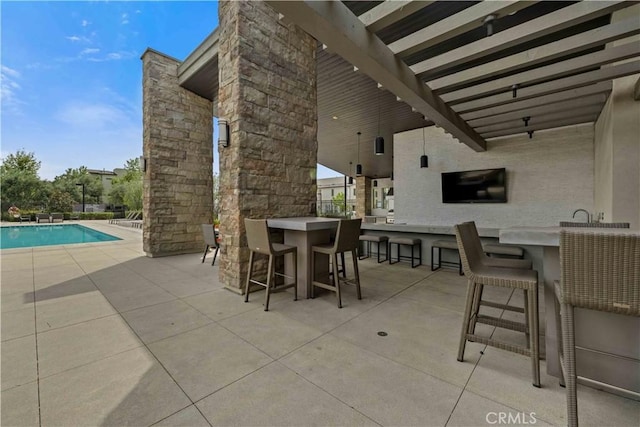 19533 Cardigan Dr, Northridge, CA 91324 - view of patio / terrace with outdoor dry bar and a community pool