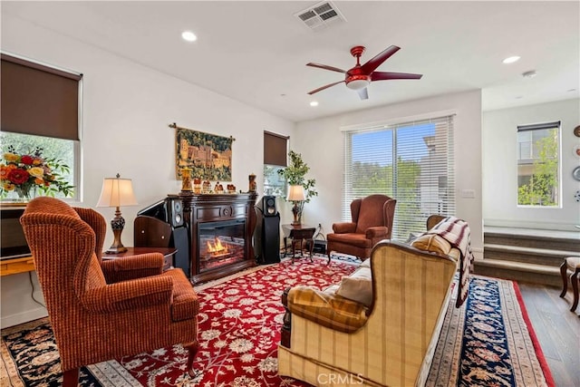 19533 Cardigan Dr, Northridge, CA 91324 - sitting room featuring wood-type flooring, a glass covered fireplace, visible vents, and recessed lighting